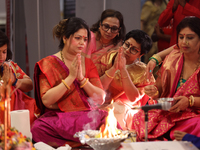 Bengali Hindu women perform prayers during the Durga Puja festival at a pandal (temporary temple) in Mississauga, Ontario, Canada, on Octobe...