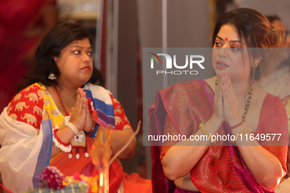 Bengali Hindu women offer prayers during the Durga Puja festival at a pandal (temporary temple) in Mississauga, Ontario, Canada, on October...