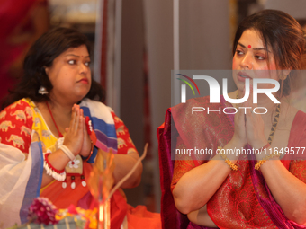 Bengali Hindu women offer prayers during the Durga Puja festival at a pandal (temporary temple) in Mississauga, Ontario, Canada, on October...