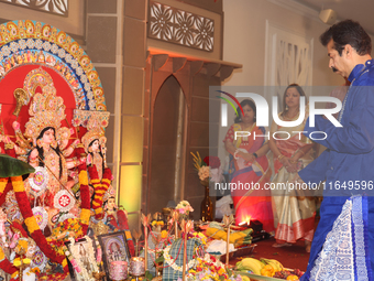 A Bengali Hindu priest performs prayers during the Durga Puja festival at a pandal (temporary temple) in Mississauga, Ontario, Canada, on Oc...