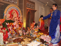 A Bengali Hindu priest performs prayers during the Durga Puja festival at a pandal (temporary temple) in Mississauga, Ontario, Canada, on Oc...