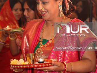 Bengali Hindu women perform prayers during the Durga Puja festival at a pandal (temporary temple) in Mississauga, Ontario, Canada, on Octobe...