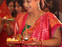 Bengali Hindu women perform prayers during the Durga Puja festival at a pandal (temporary temple) in Mississauga, Ontario, Canada, on Octobe...