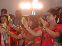 Bengali Hindu women perform prayers during the Durga Puja festival at a pandal (temporary temple) in Mississauga, Ontario, Canada, on Octobe...