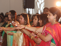 Bengali Hindu women perform prayers during the Durga Puja festival at a pandal (temporary temple) in Mississauga, Ontario, Canada, on Octobe...