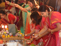 Bengali Hindu women perform prayers during the Durga Puja festival at a pandal (temporary temple) in Mississauga, Ontario, Canada, on Octobe...