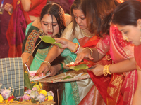 Bengali Hindu women perform prayers during the Durga Puja festival at a pandal (temporary temple) in Mississauga, Ontario, Canada, on Octobe...