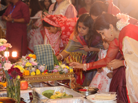 Bengali Hindu women perform prayers during the Durga Puja festival at a pandal (temporary temple) in Mississauga, Ontario, Canada, on Octobe...