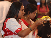 Bengali Hindu women perform prayers during the Durga Puja festival at a pandal (temporary temple) in Mississauga, Ontario, Canada, on Octobe...