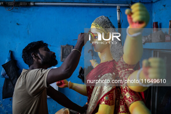 Bangladeshi artisans prepare a clay idol of the Hindu Goddess Durga for the upcoming Hindu religious festival Durga Puja in Dhaka, Banglades...