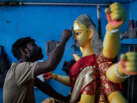 Bangladeshi artisans prepare a clay idol of the Hindu Goddess Durga for the upcoming Hindu religious festival Durga Puja in Dhaka, Banglades...