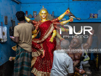 Bangladeshi artisans prepare a clay idol of the Hindu Goddess Durga for the upcoming Hindu religious festival Durga Puja in Dhaka, Banglades...