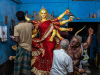 Bangladeshi artisans prepare a clay idol of the Hindu Goddess Durga for the upcoming Hindu religious festival Durga Puja in Dhaka, Banglades...