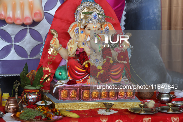 An idol of Lord Ganesh is surrounded by puja items during the Sree Ganesh Chaturthi Mahotsav festival in Brampton, Ontario, Canada, on Septe...