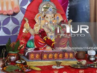 An idol of Lord Ganesh is surrounded by puja items during the Sree Ganesh Chaturthi Mahotsav festival in Brampton, Ontario, Canada, on Septe...