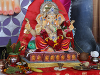 An idol of Lord Ganesh is surrounded by puja items during the Sree Ganesh Chaturthi Mahotsav festival in Brampton, Ontario, Canada, on Septe...