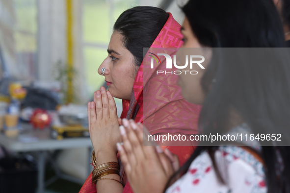 Hindu devotees offer prayers during the Sree Ganesh Chaturthi Mahotsav festival in Brampton, Ontario, Canada, on September 14, 2024. Ganesh...