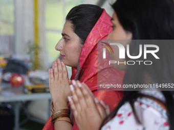 Hindu devotees offer prayers during the Sree Ganesh Chaturthi Mahotsav festival in Brampton, Ontario, Canada, on September 14, 2024. Ganesh...