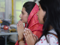 Hindu devotees offer prayers during the Sree Ganesh Chaturthi Mahotsav festival in Brampton, Ontario, Canada, on September 14, 2024. Ganesh...