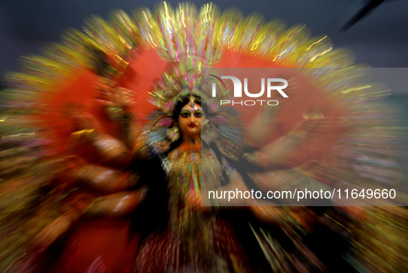 A Durga idol is seen at a worship venue on the eve of the Durga Puja festival in Bhubaneswar, the capital city of the eastern Indian state o...