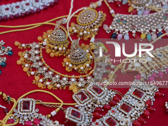 Indian jewellery is displayed at a small stall selling costume jewellery and temple jewellery during the Sree Ganesh Chaturthi Mahotsav fest...