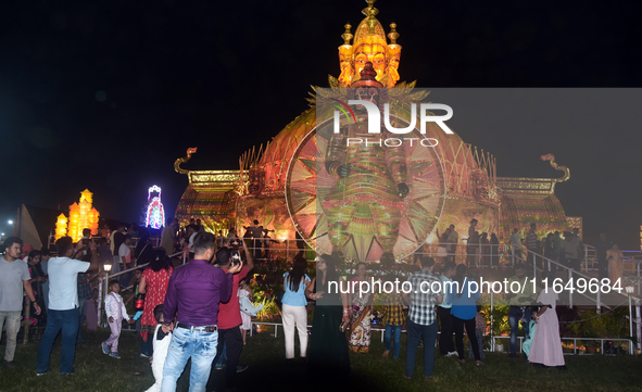 Devotees arrive to see an idol and Puja Pandal of the Hindu goddess 'Durga' during the Durga Puja festival in Siliguri, India, on October 8,...