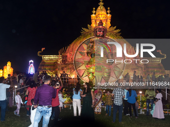 Devotees arrive to see an idol and Puja Pandal of the Hindu goddess 'Durga' during the Durga Puja festival in Siliguri, India, on October 8,...