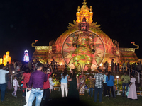 Devotees arrive to see an idol and Puja Pandal of the Hindu goddess 'Durga' during the Durga Puja festival in Siliguri, India, on October 8,...