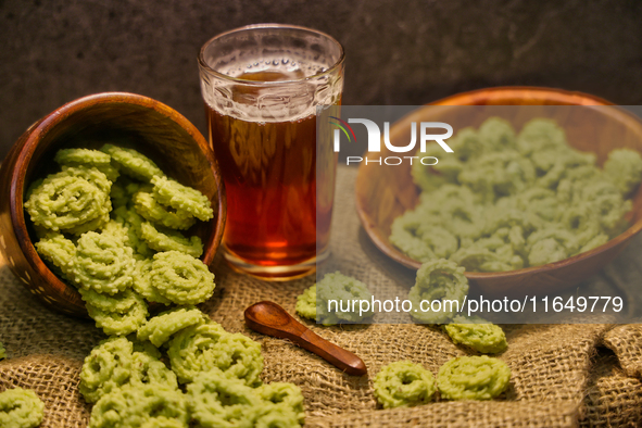 Palak murukku (spinach murukku) accompanies black tea in Toronto, Ontario, Canada, on October 08, 2024. Murukku is a savory, crunchy snack o...