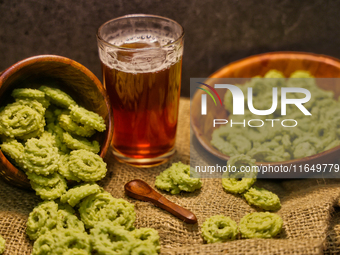 Palak murukku (spinach murukku) accompanies black tea in Toronto, Ontario, Canada, on October 08, 2024. Murukku is a savory, crunchy snack o...