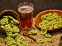 Palak murukku (spinach murukku) accompanies black tea in Toronto, Ontario, Canada, on October 08, 2024. Murukku is a savory, crunchy snack o...