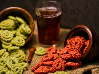 Palak murukku (spinach murukku) and beetroot murukku are served with black tea in Toronto, Ontario, Canada, on October 8, 2024. Murukku is a...