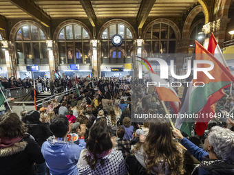 Hundreds of protesters flocked Amsterdam Centraal, the main central railway station and held a sit-in Pro-Palestine protest. A rally to mark...