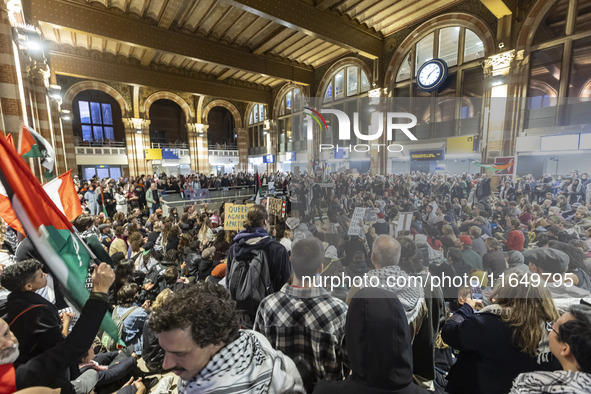 Hundreds of protesters flocked Amsterdam Centraal, the main central railway station and held a sit-in Pro-Palestine protest. A rally to mark...