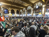 Hundreds of protesters flocked Amsterdam Centraal, the main central railway station and held a sit-in Pro-Palestine protest. A rally to mark...