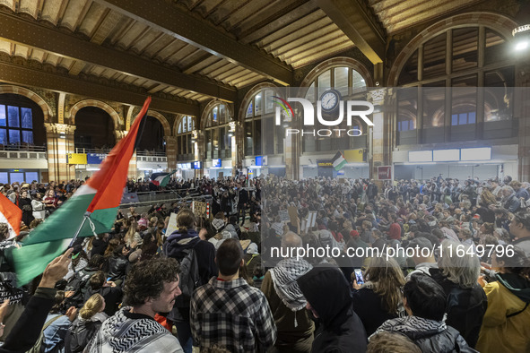 Hundreds of protesters flocked Amsterdam Centraal, the main central railway station and held a sit-in Pro-Palestine protest. A rally to mark...