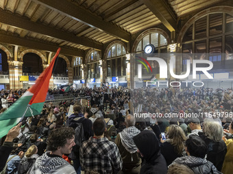 Hundreds of protesters flocked Amsterdam Centraal, the main central railway station and held a sit-in Pro-Palestine protest. A rally to mark...