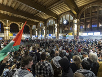 Hundreds of protesters flocked Amsterdam Centraal, the main central railway station and held a sit-in Pro-Palestine protest. A rally to mark...