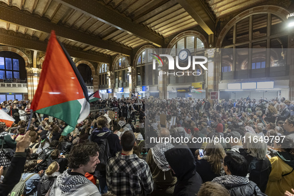 Hundreds of protesters flocked Amsterdam Centraal, the main central railway station and held a sit-in Pro-Palestine protest. A rally to mark...