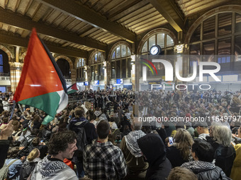 Hundreds of protesters flocked Amsterdam Centraal, the main central railway station and held a sit-in Pro-Palestine protest. A rally to mark...