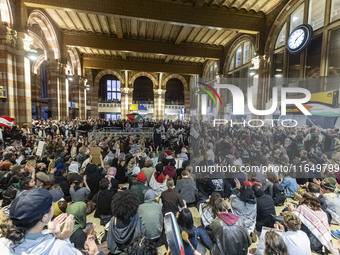 Hundreds of protesters flocked Amsterdam Centraal, the main central railway station and held a sit-in Pro-Palestine protest. A rally to mark...