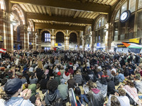 Hundreds of protesters flocked Amsterdam Centraal, the main central railway station and held a sit-in Pro-Palestine protest. A rally to mark...