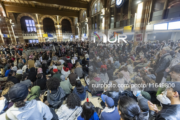 Hundreds of protesters flocked Amsterdam Centraal, the main central railway station and held a sit-in Pro-Palestine protest. A rally to mark...