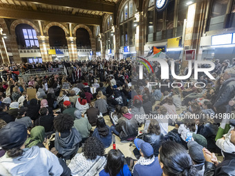 Hundreds of protesters flocked Amsterdam Centraal, the main central railway station and held a sit-in Pro-Palestine protest. A rally to mark...