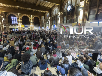 Hundreds of protesters flocked Amsterdam Centraal, the main central railway station and held a sit-in Pro-Palestine protest. A rally to mark...