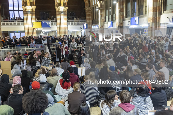 Hundreds of protesters flocked Amsterdam Centraal, the main central railway station and held a sit-in Pro-Palestine protest. A rally to mark...