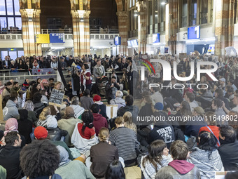 Hundreds of protesters flocked Amsterdam Centraal, the main central railway station and held a sit-in Pro-Palestine protest. A rally to mark...