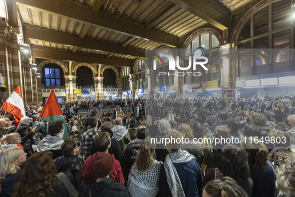 Hundreds of protesters flocked Amsterdam Centraal, the main central railway station and held a sit-in Pro-Palestine protest. A rally to mark...