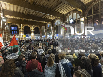 Hundreds of protesters flocked Amsterdam Centraal, the main central railway station and held a sit-in Pro-Palestine protest. A rally to mark...