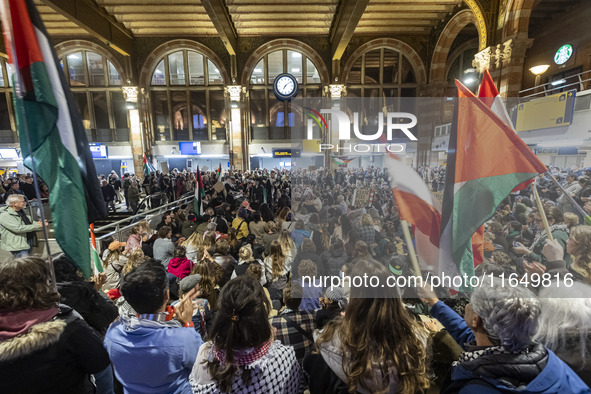 Hundreds of protesters flocked Amsterdam Centraal, the main central railway station and held a sit-in Pro-Palestine protest. A rally to mark...